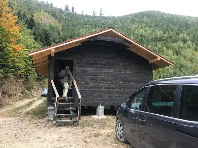 Bear watching hide exterior at forest edge in autumn — Carpathian Mountains Romania, Ibis Tours